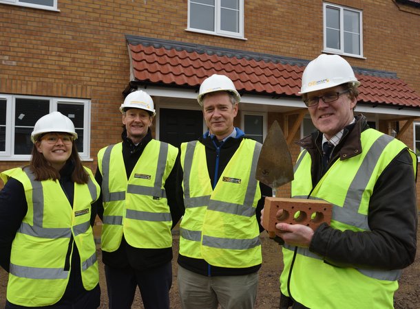 CHS Chief Exec Nigel Howlett and staff in hi viz jackets opening new CHS social homes