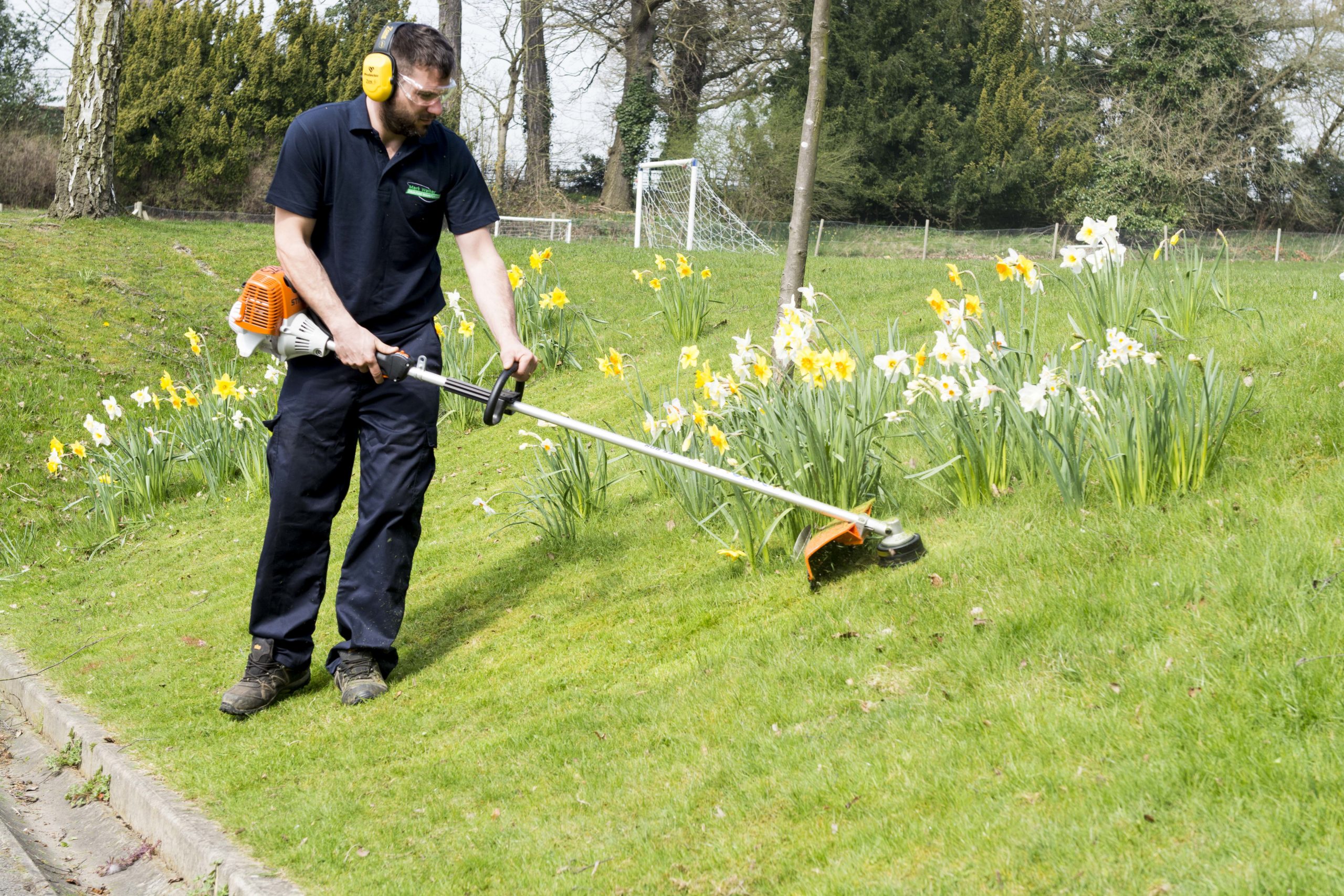 Gardener cutting the grass