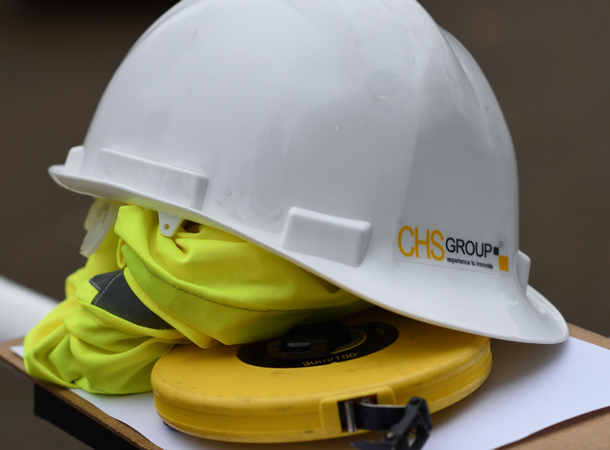 CHS hard hat and hi viz jacket with measuring tape